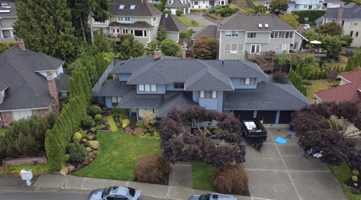 Completed dark gray residential roof replacement by P.J Roofing LLC